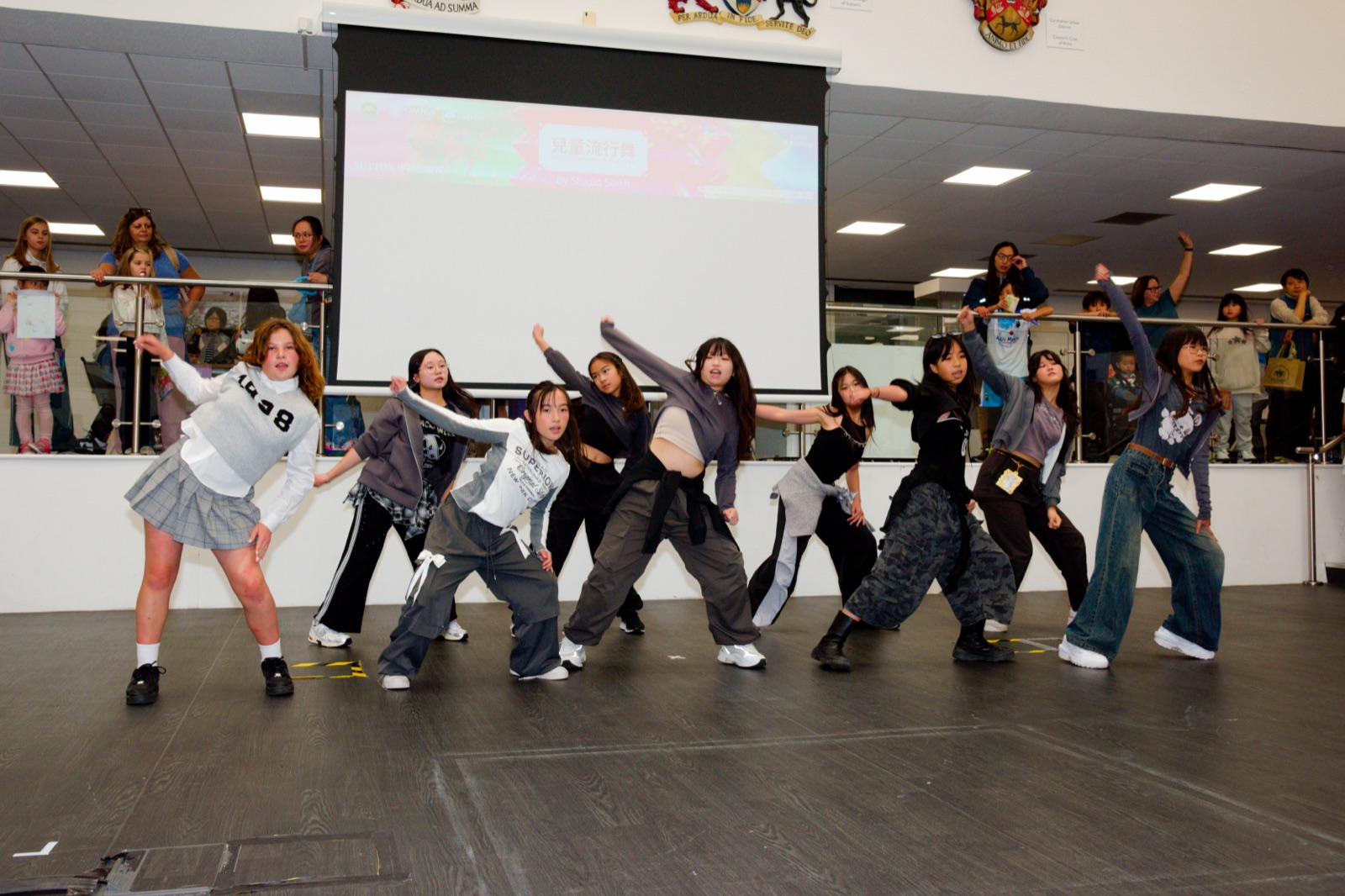 Youth dance troupe performing on stage