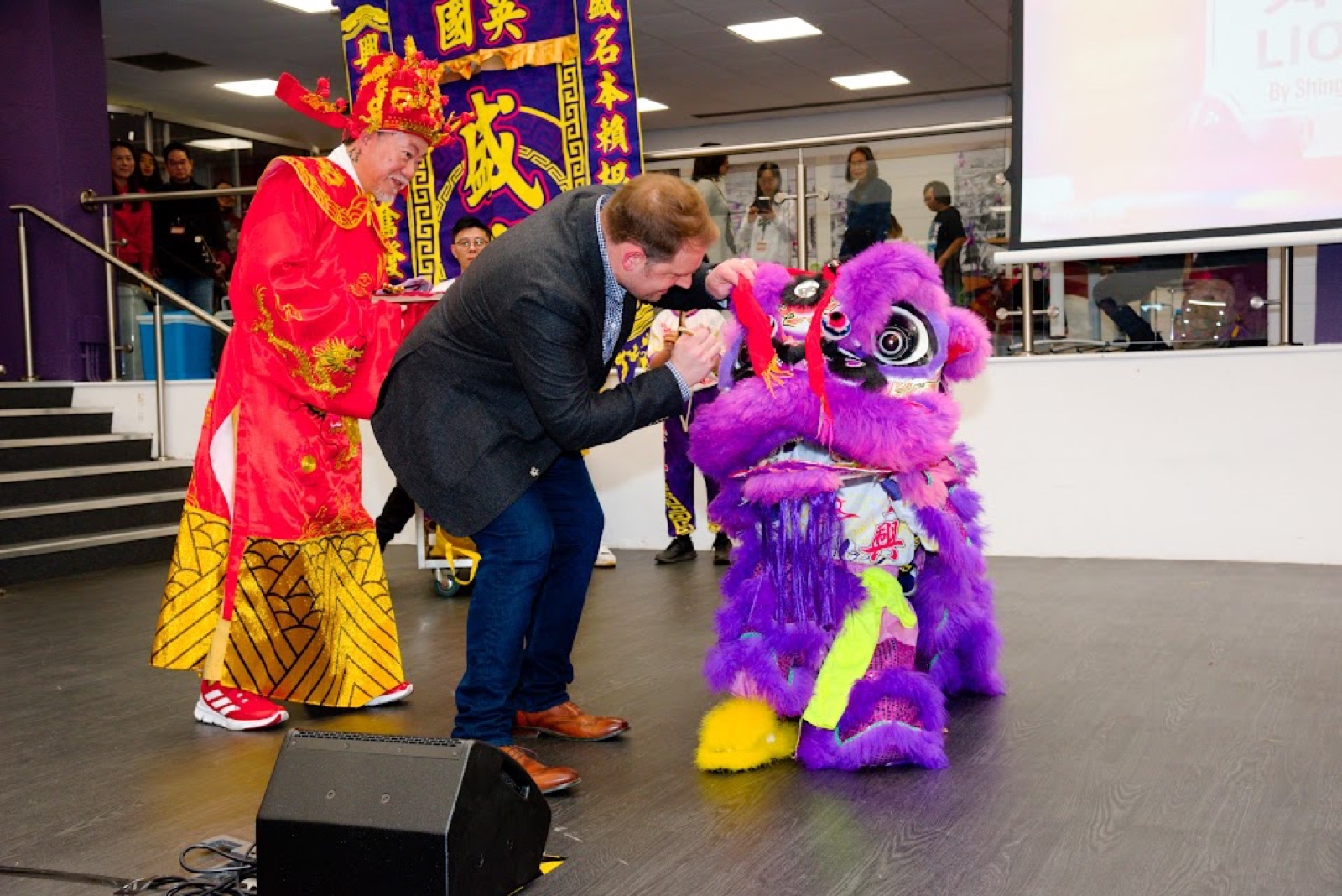 Lion dance at the Sutton Lunar New Year celebration, with the local MP painting the lion's eyes
