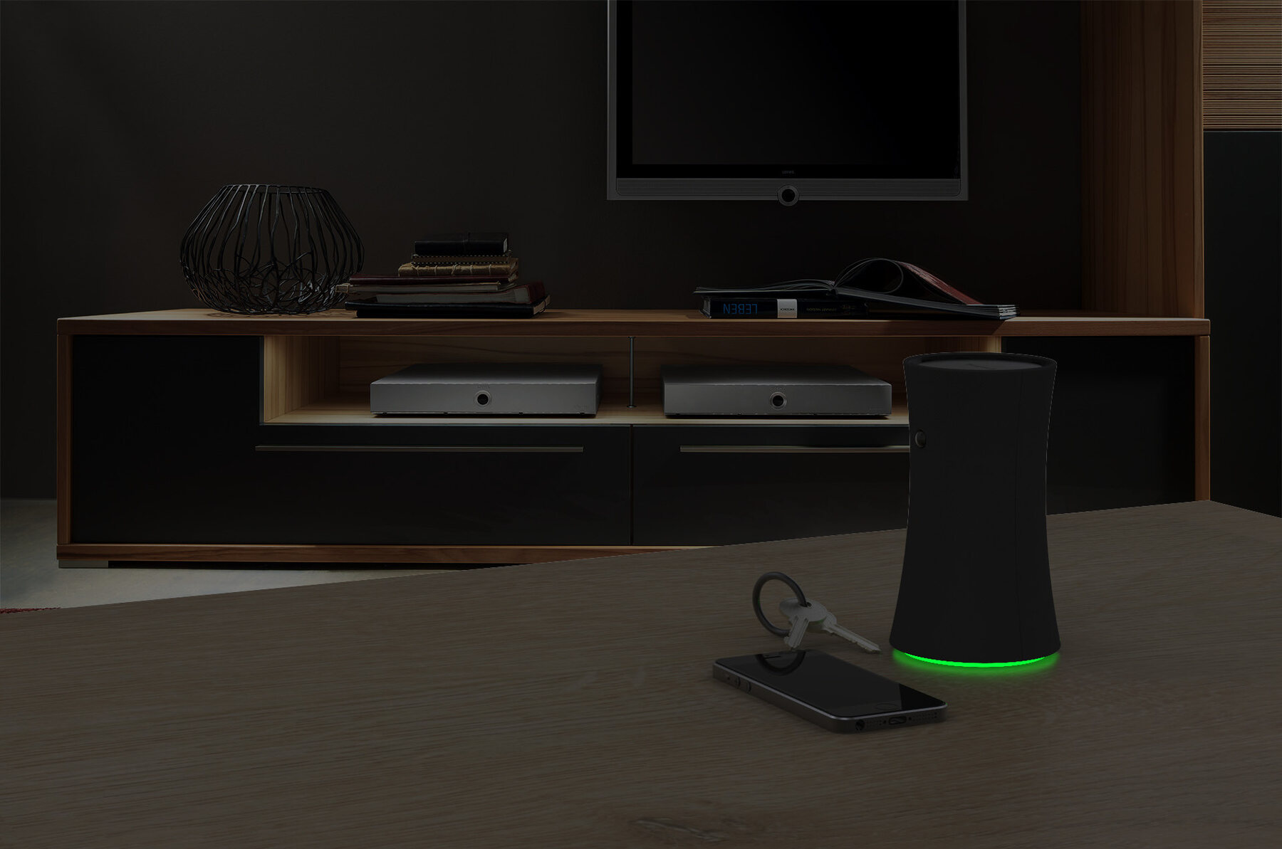 DAS hub glowing green in a dark living room